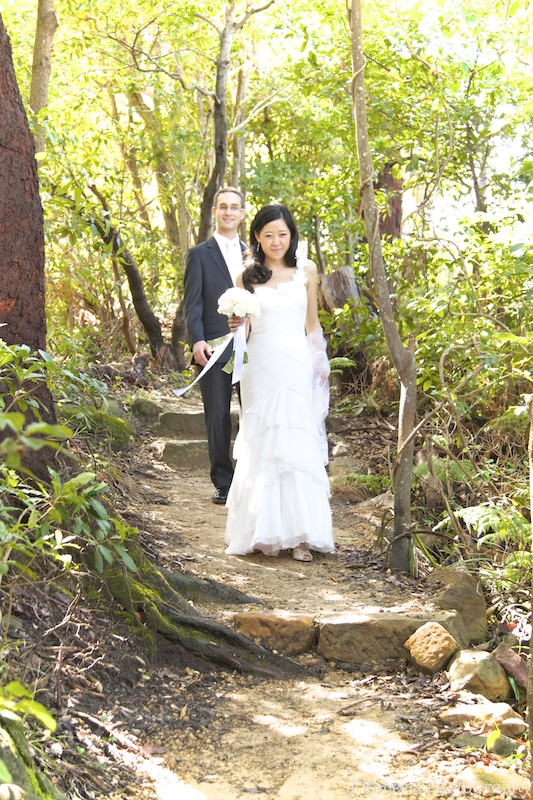 Bride and groom walking bush track - wedding photography sydney